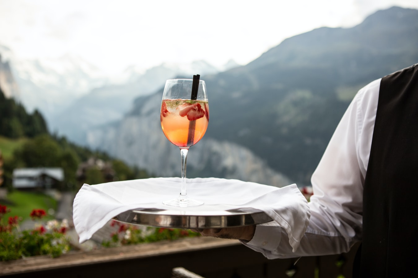 Waiter serving a drink