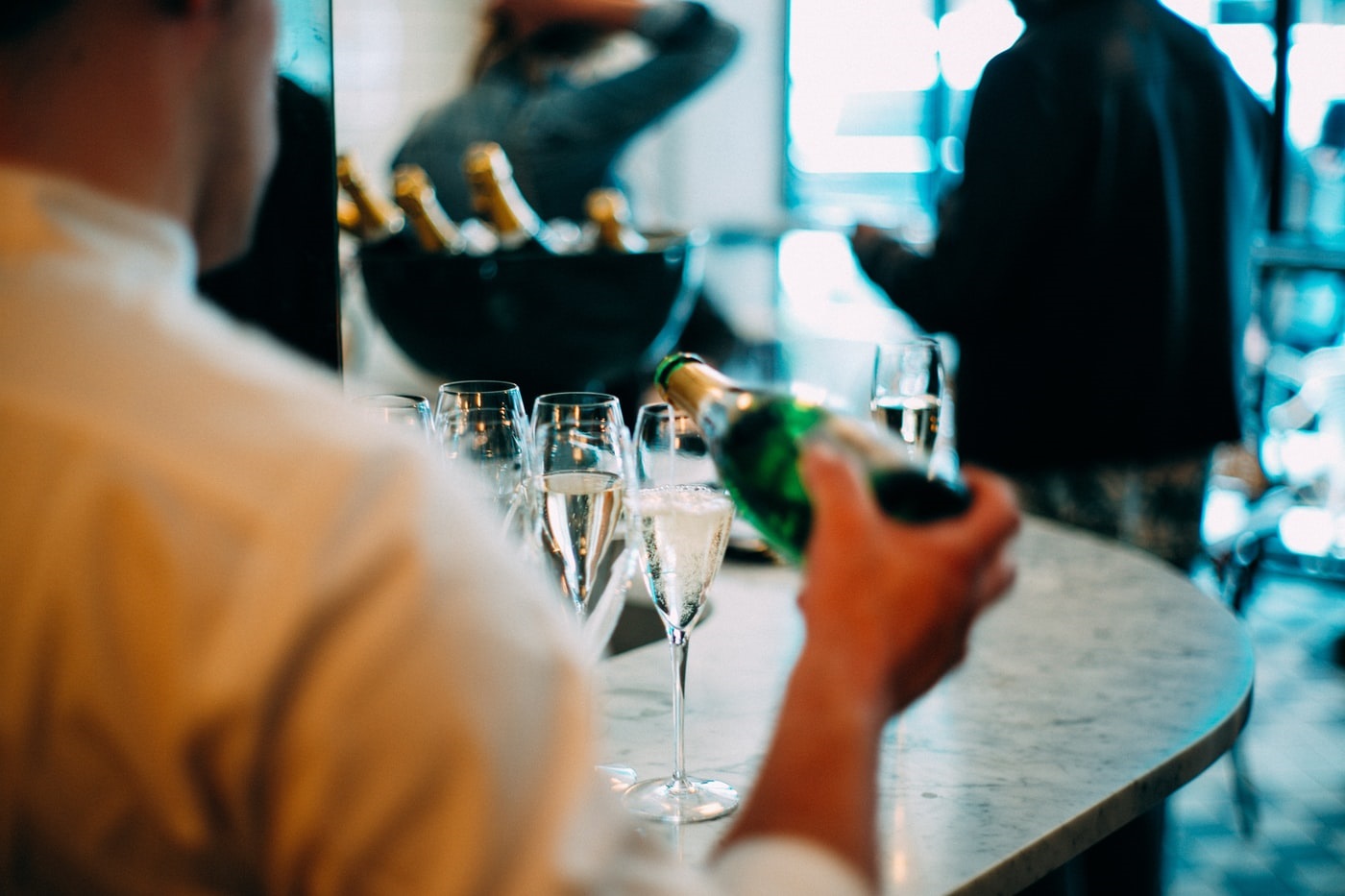 waiter serving a drink